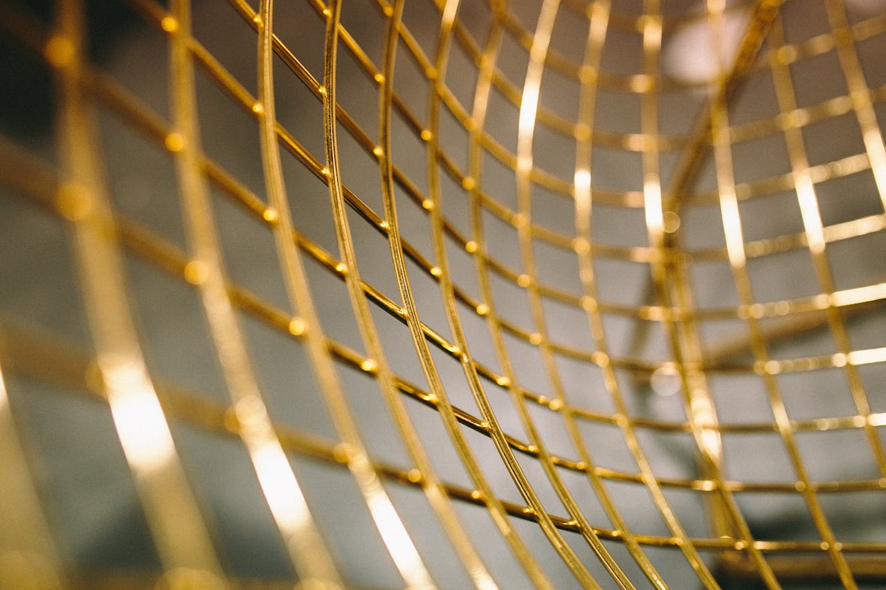 The Art of Drawing Readers In: Your attractive post title goes here Close-up abstract of golden grid lines creating a modern artistic pattern, perfect for backgrounds.
